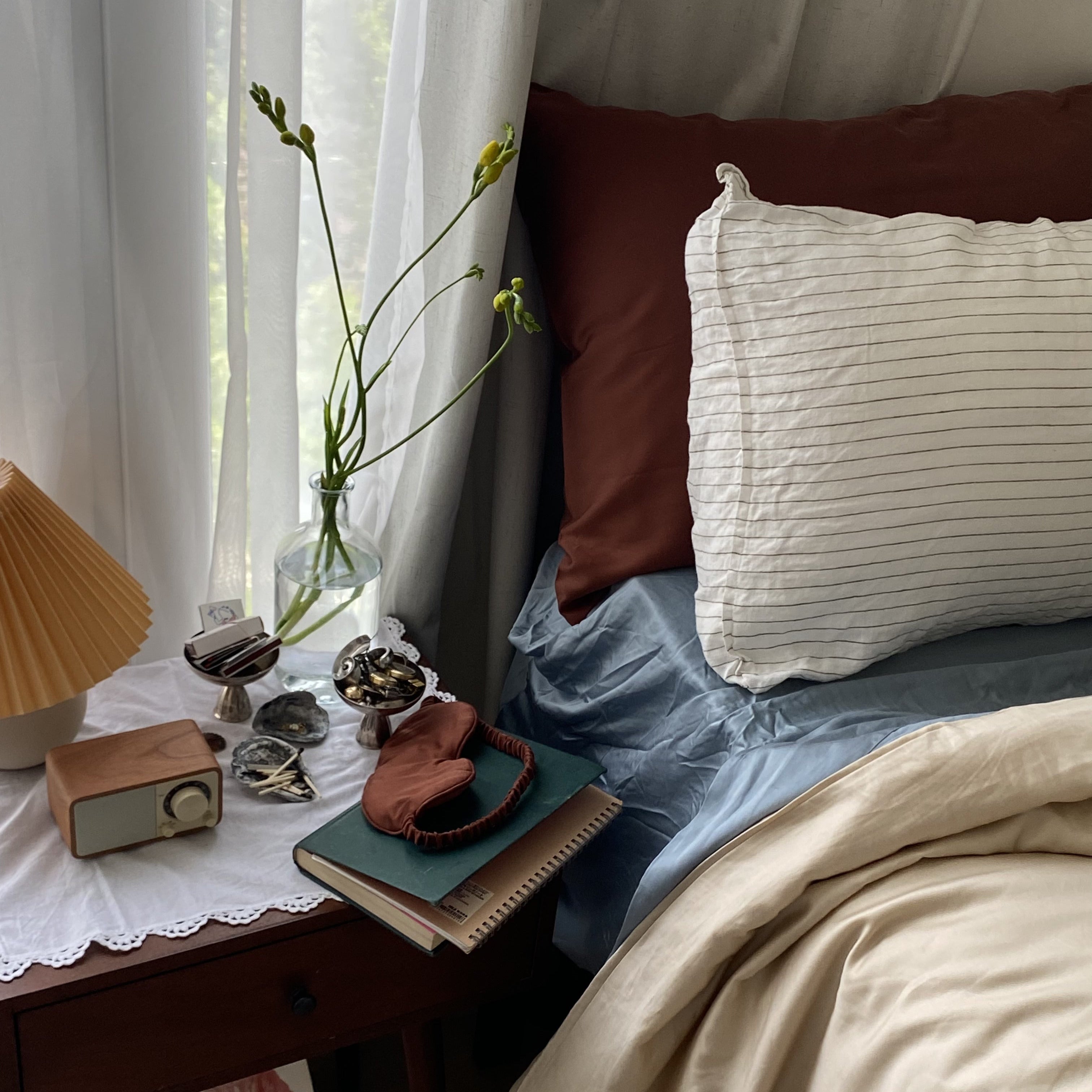 Eucalyptus lyocell bedding styled with nightstand decor, breathable sheets, and cozy bedroom details