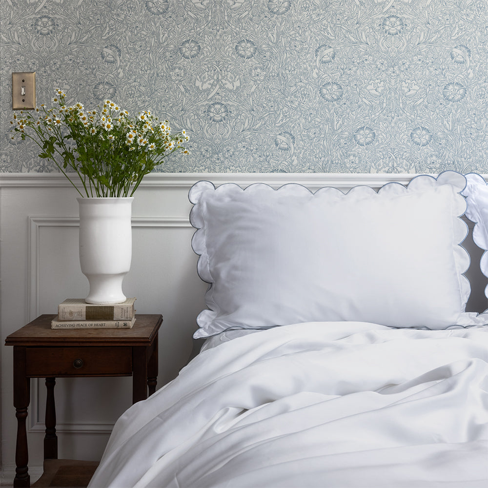 Eucalypso eucalyptus TENCEL™ lyocell pillowcases with scalloped edge, styled on a white bed for breathable, cooling sleep